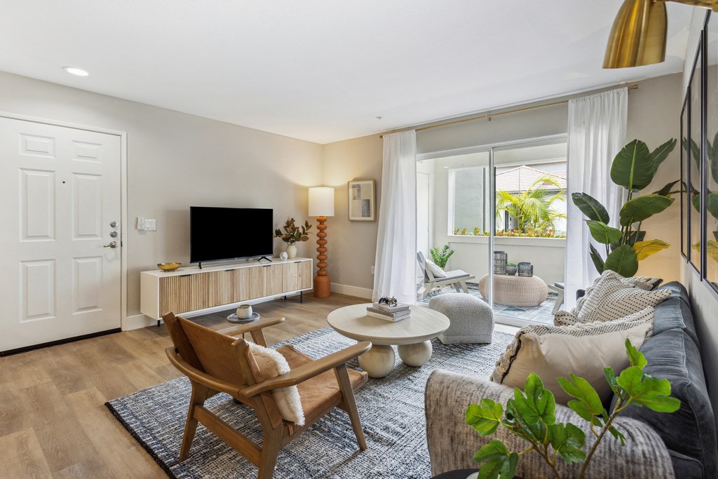 a living room with a couch and a tv