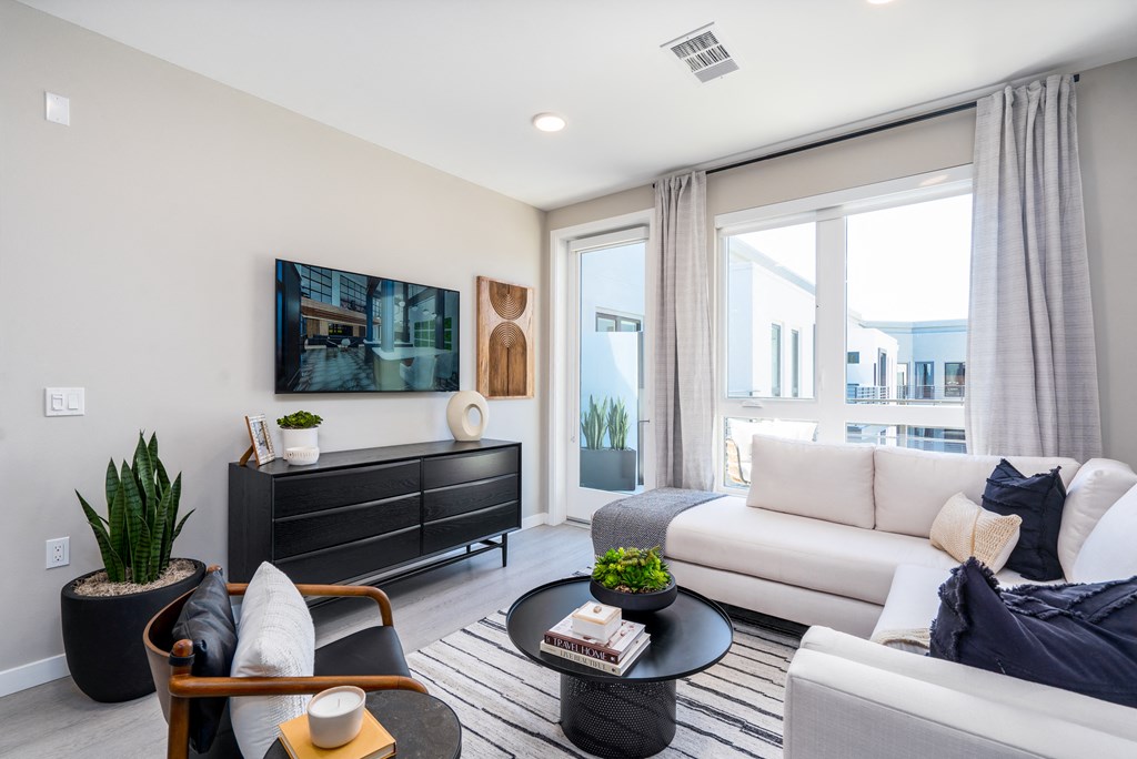 a living room with a couch and a tv