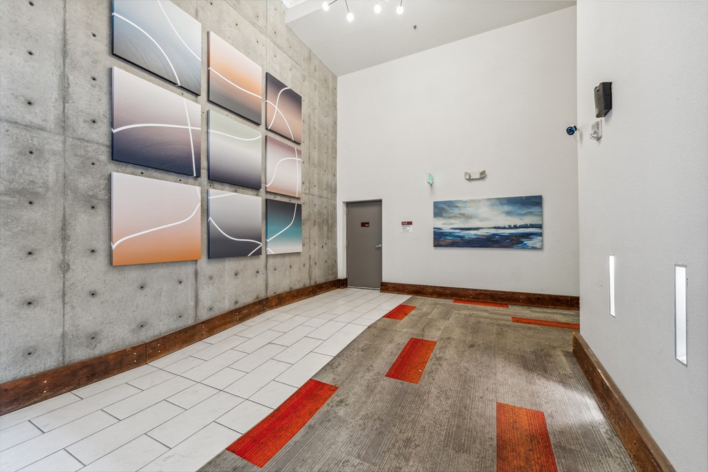 a room with a tiled floor and a painting on the wall