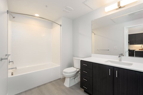 a bathroom with a sink toilet and a shower