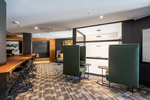 a conference room with tables and chairs and a large window