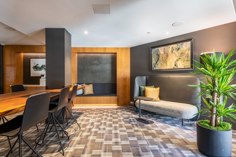 a living room with a table and chairs and a couch