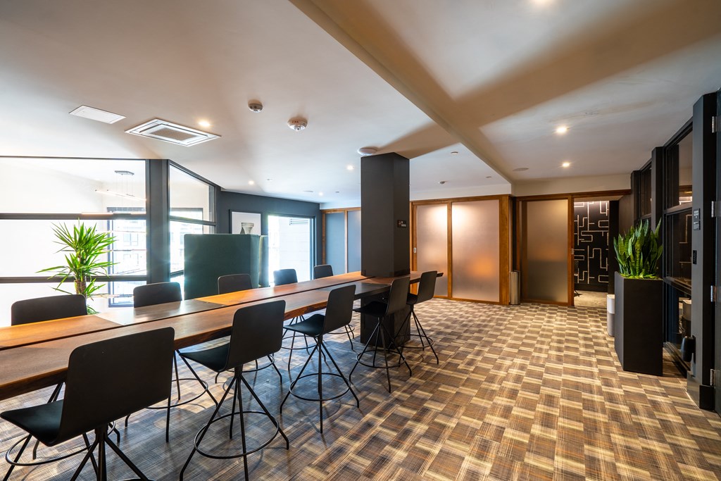 a large conference room with a long table and chairs