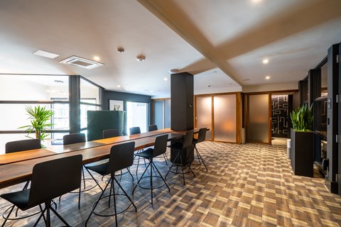 a large conference room with a long table and chairs