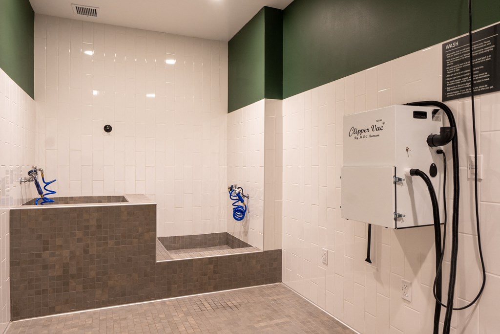 a bathroom with a shower and a tub and a sink