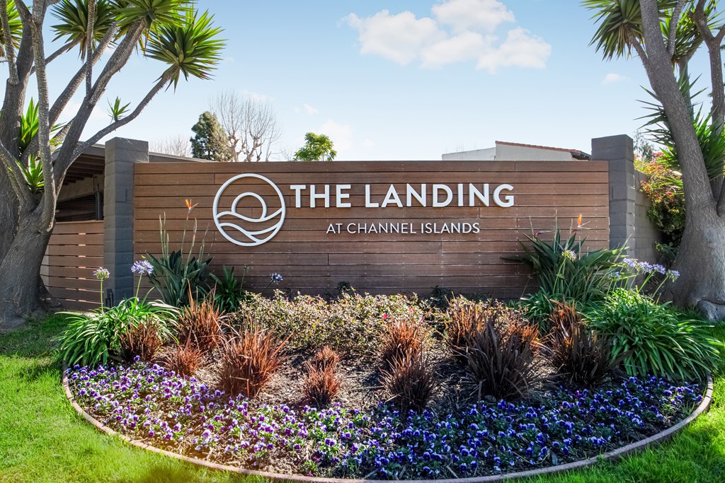 The Landing at Channel Islands sign with a garden in front.