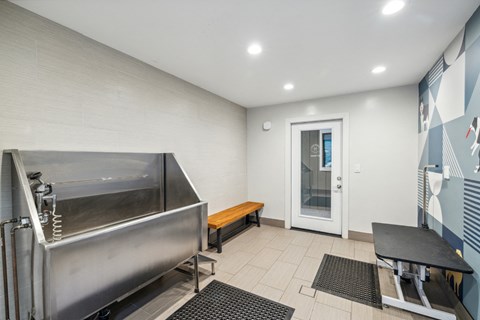 a kitchen with a stainless steel stove and a table