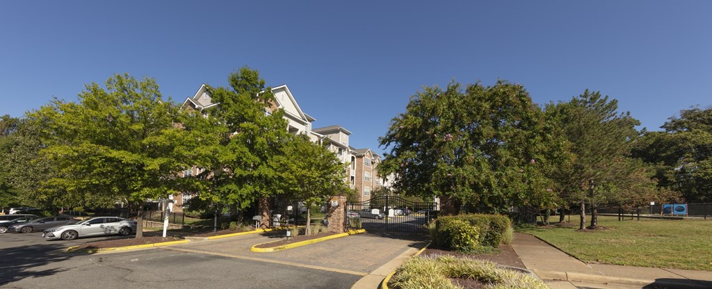 A large building with a parking lot in front of it.