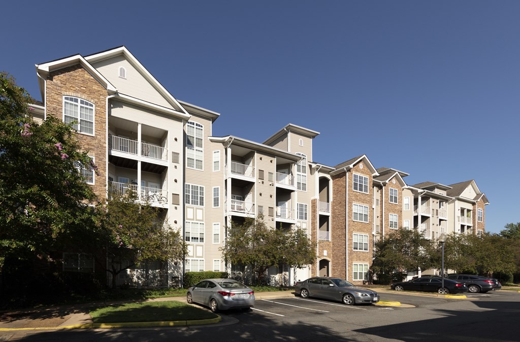 A car is parked in front of a building.