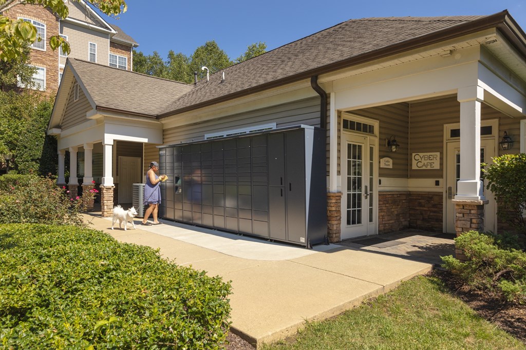 A Cyber Café is located in a building with a glass door.