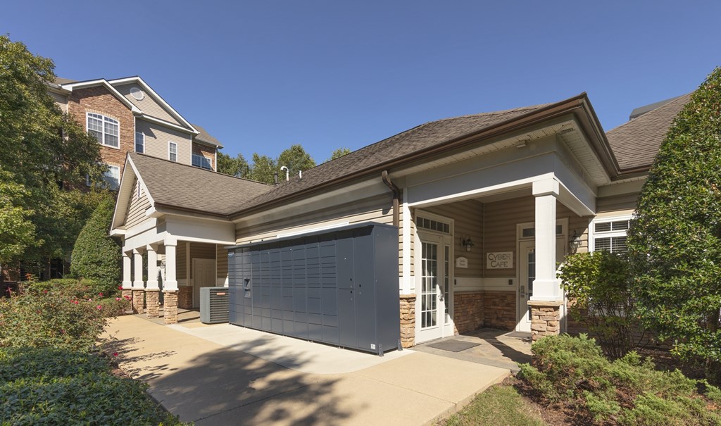 A house with a garage door and a driveway.