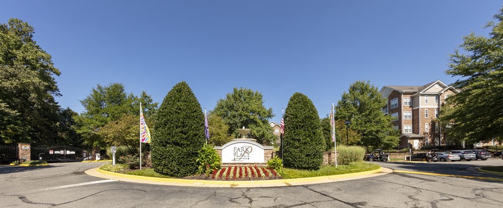 A large white sign with the word "DOCTOR" on it is in the middle of a roundabout.