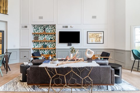 a living room with a couch and a table and a television
