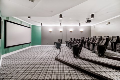 a large room with chairs and a projection screen
