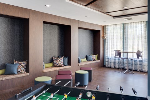 a room filled with furniture and a large window