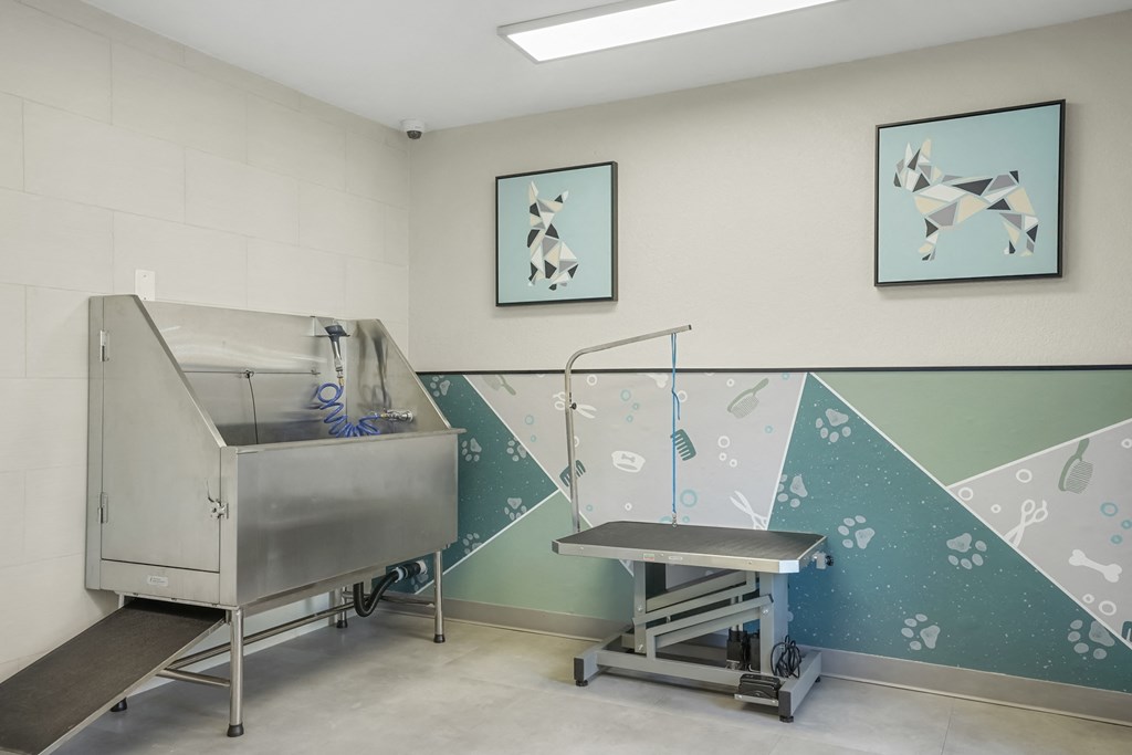 a hospital room with a sink and a hospital bed