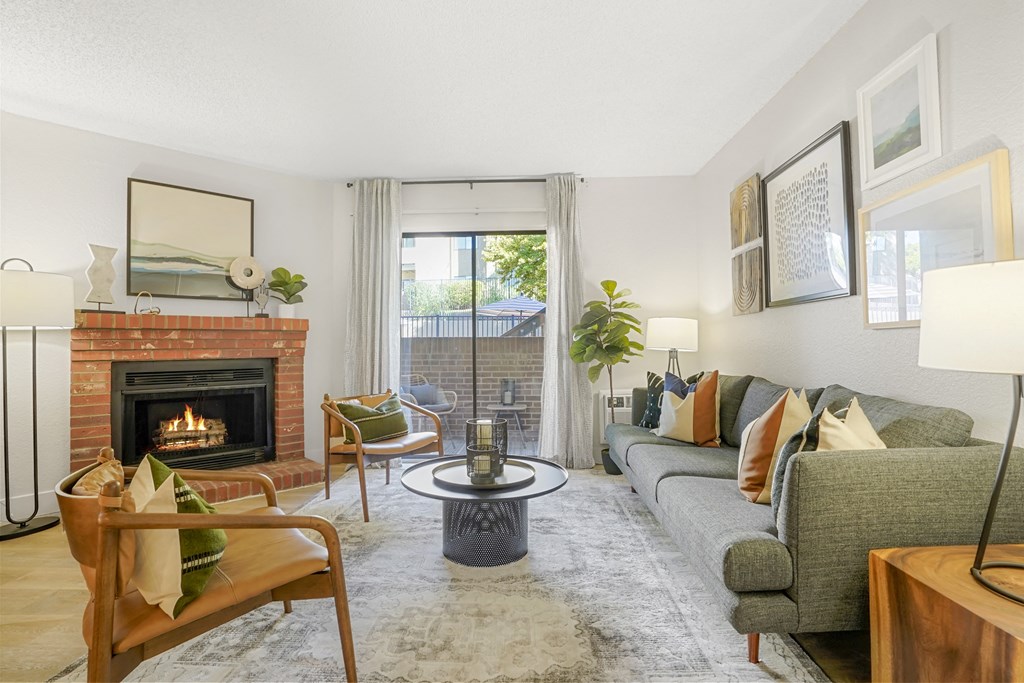 a living room with a couch and a fireplace