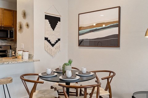 a dining room with a table and chairs