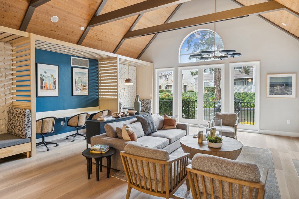 a living room with a couch and a table with chairs