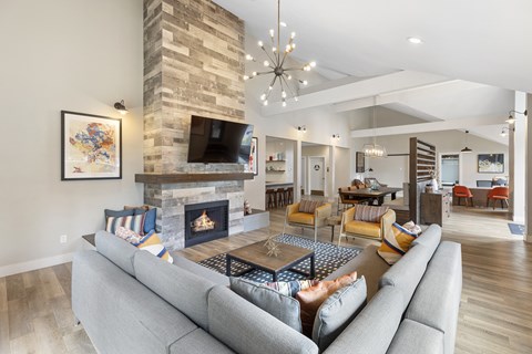 a living room with a couch and a fireplace