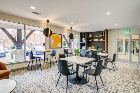 a room filled with furniture and a large window