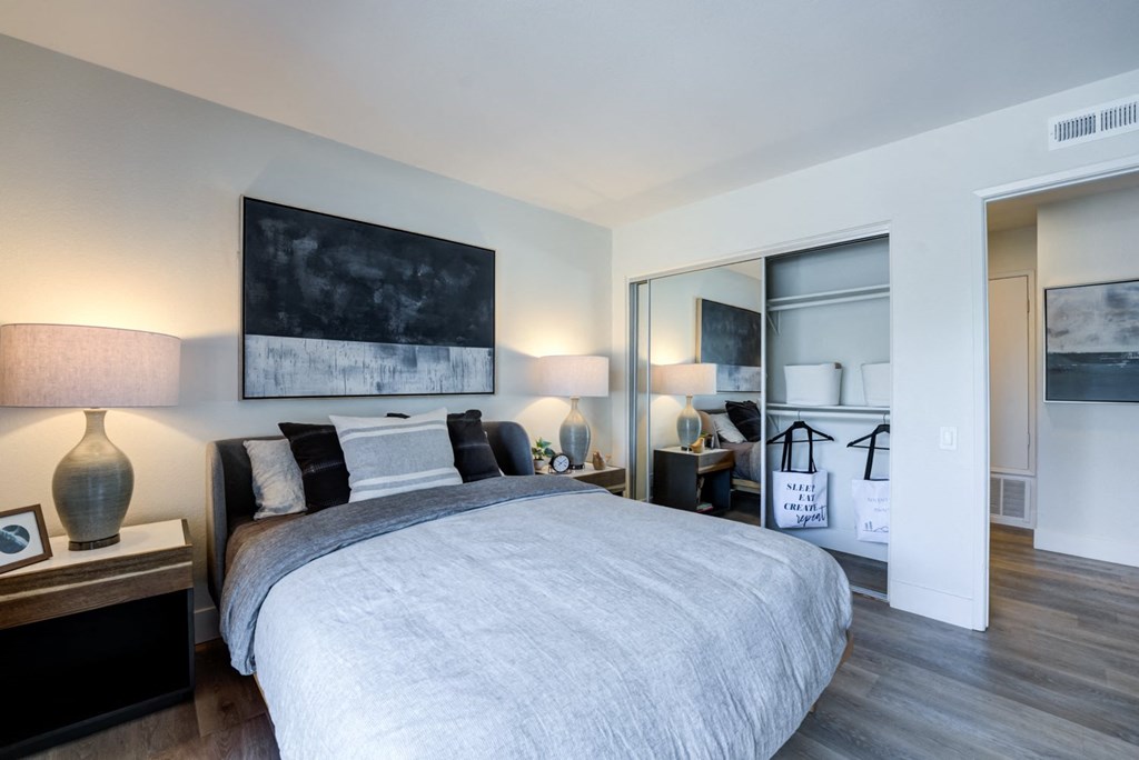 a bedroom with a large bed in a room