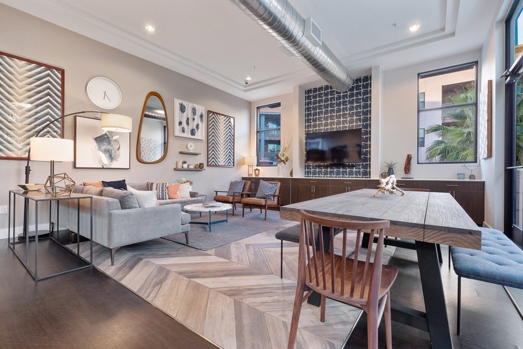 a living room with a table and a couch and a tv
