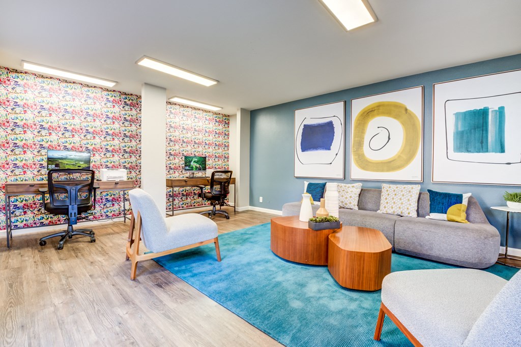 a living room with blue walls and a blue rug
