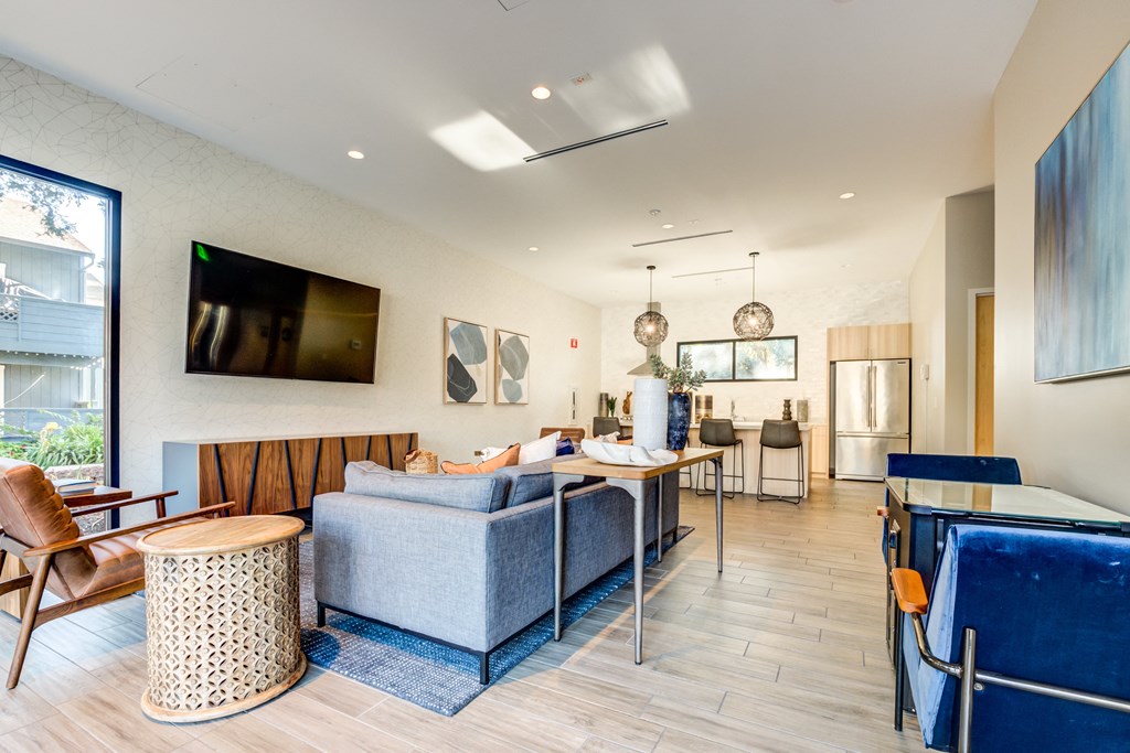 a living room with a couch a table and a chair