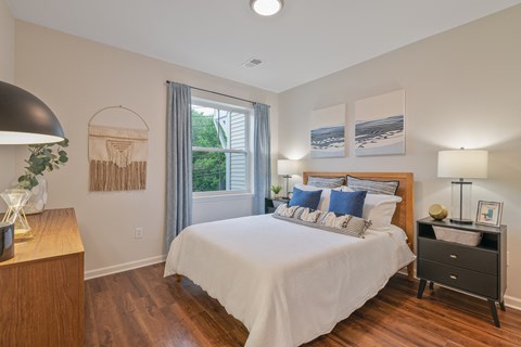 a bedroom with a bed and a window