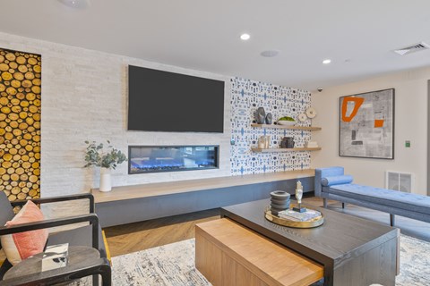 a living room with a fireplace and a television