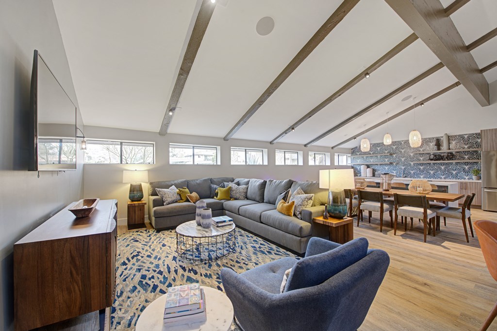 a large clubhouse with kitchen and couches