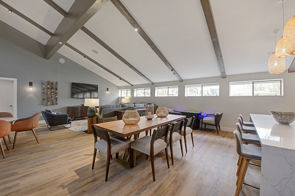 a large clubhouse with dining area, lounge area, and kitchen