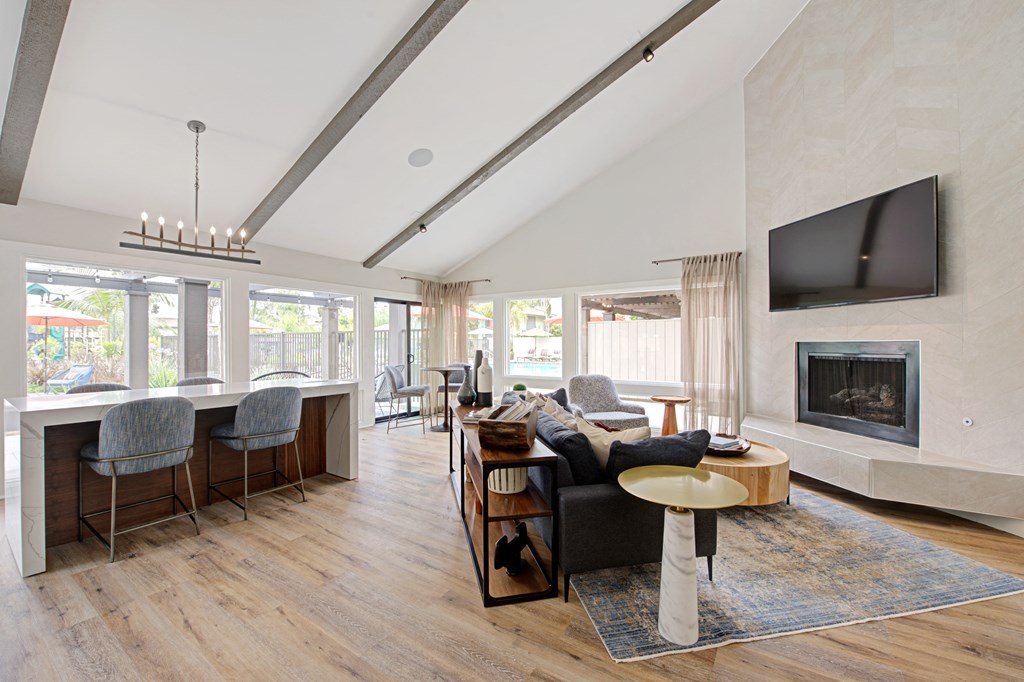 clubhouse with fireplace, couches, and large windows