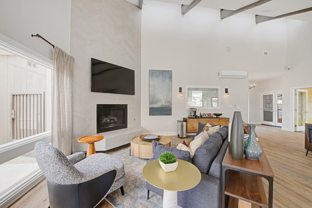 a large management office with couches and a fireplace