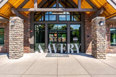The front of a building with a sign that says "Avery" on it.