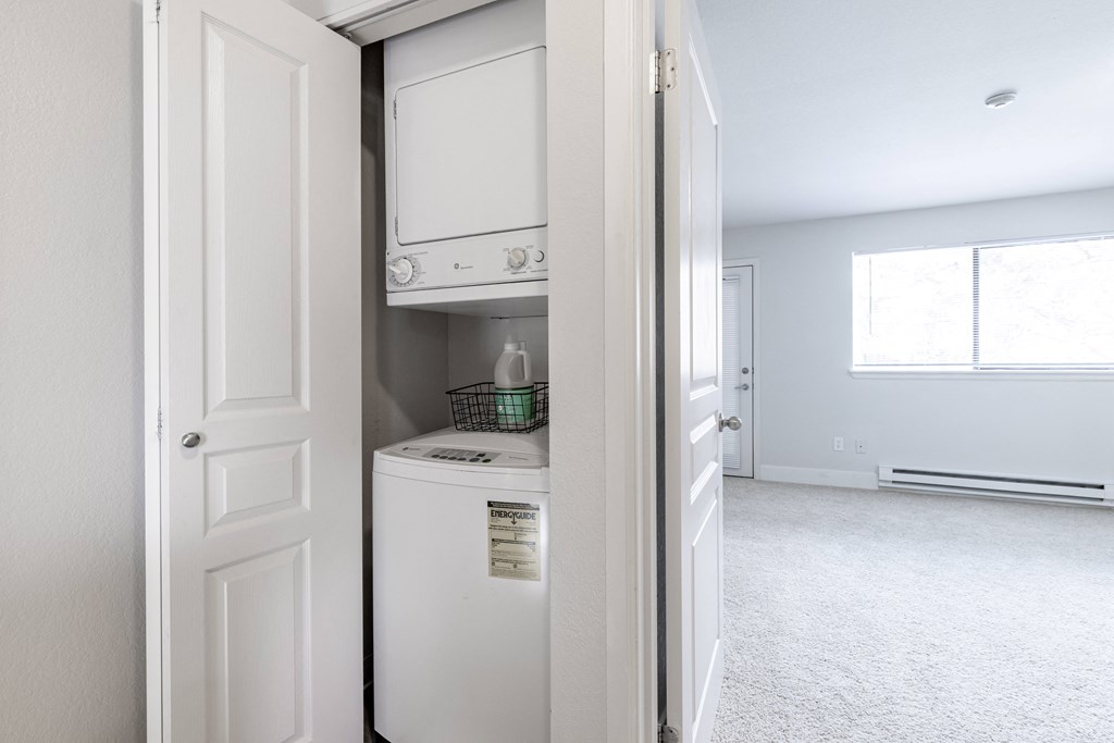 a small laundry room with a washer and dryer