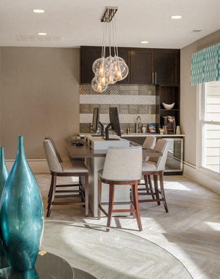 a kitchen and dining room with a table and chairs