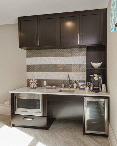 a small kitchen with a microwave and a sink