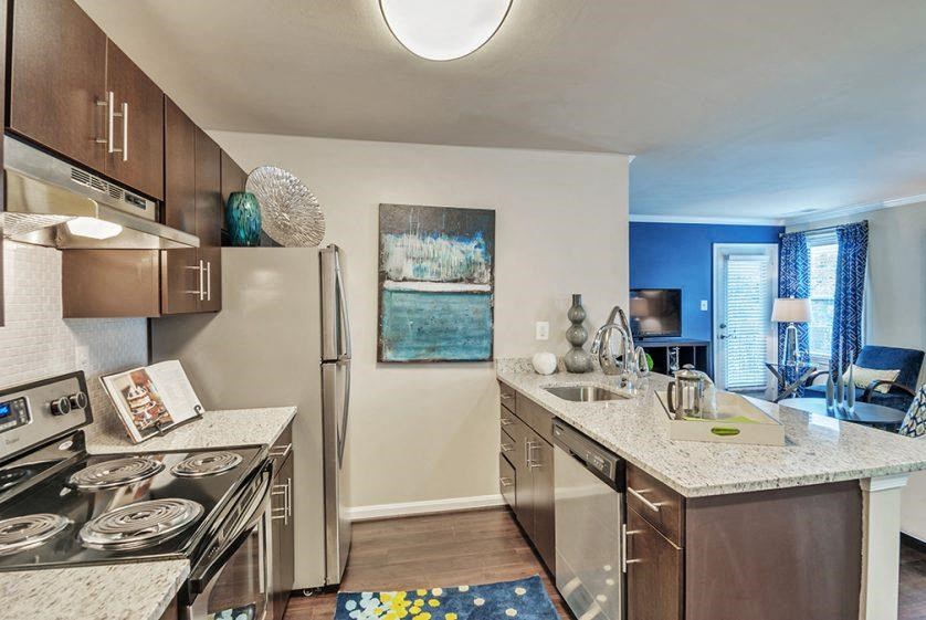 a kitchen with stainless steel appliances and a granite counter top