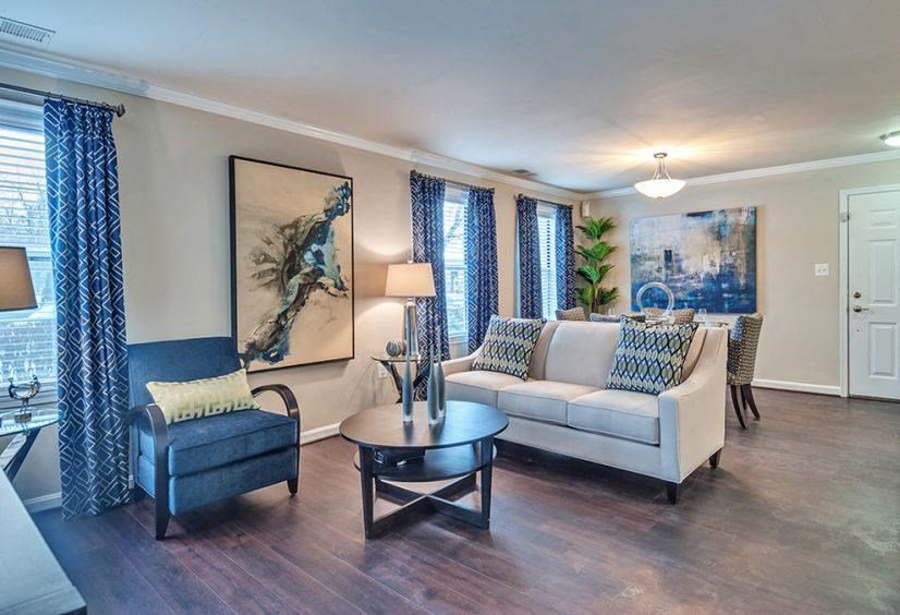 a living room with a couch and a table