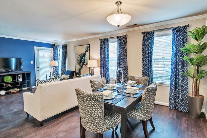 a dining room with a table and chairs
