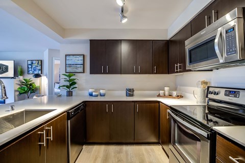 full kitchen with stainless steel appliances at the reserve at walnut creek