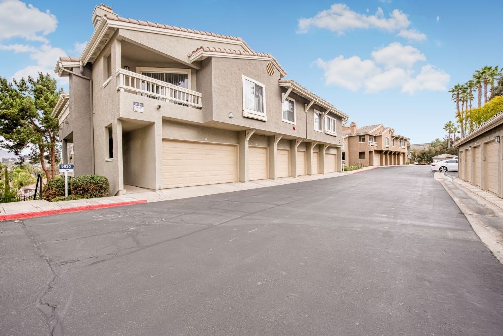A row of houses with a street in between.