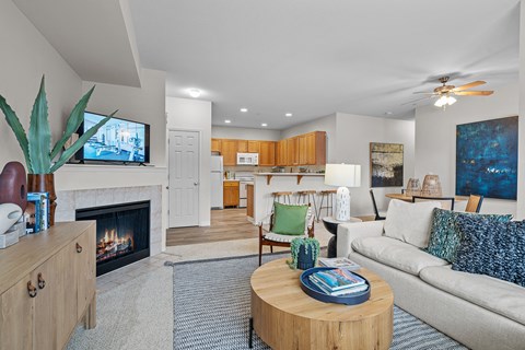 a living room with a fireplace and a couch