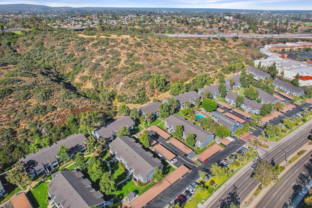 an aerial view of a neighborhood with houses and trees