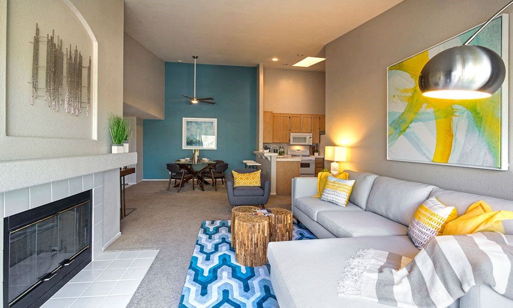 a living room with a couch and a fireplace