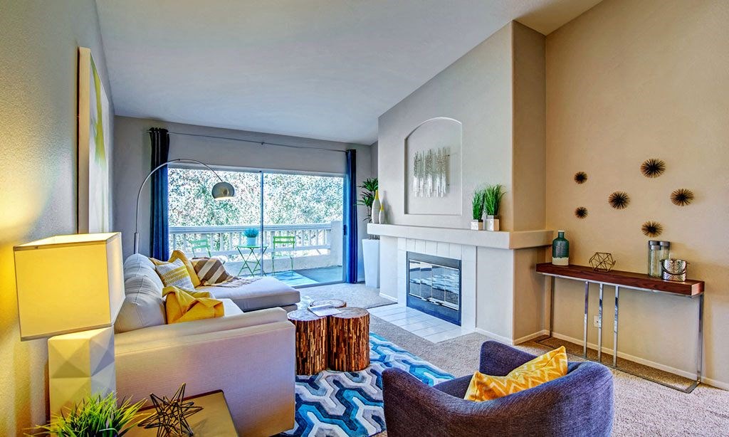 a living room with a fireplace and a couch