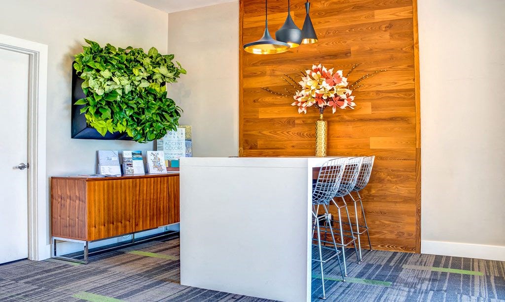 a dining room with a table and chairs