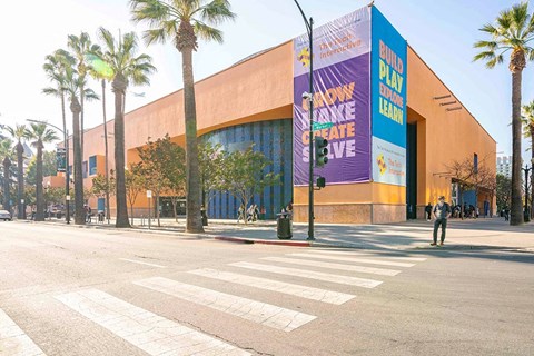 an empty street in front of a large building